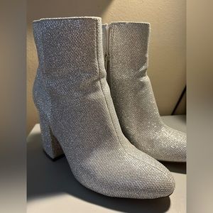 Sparkly silver heeled boots — perfect for the Eras Tour!